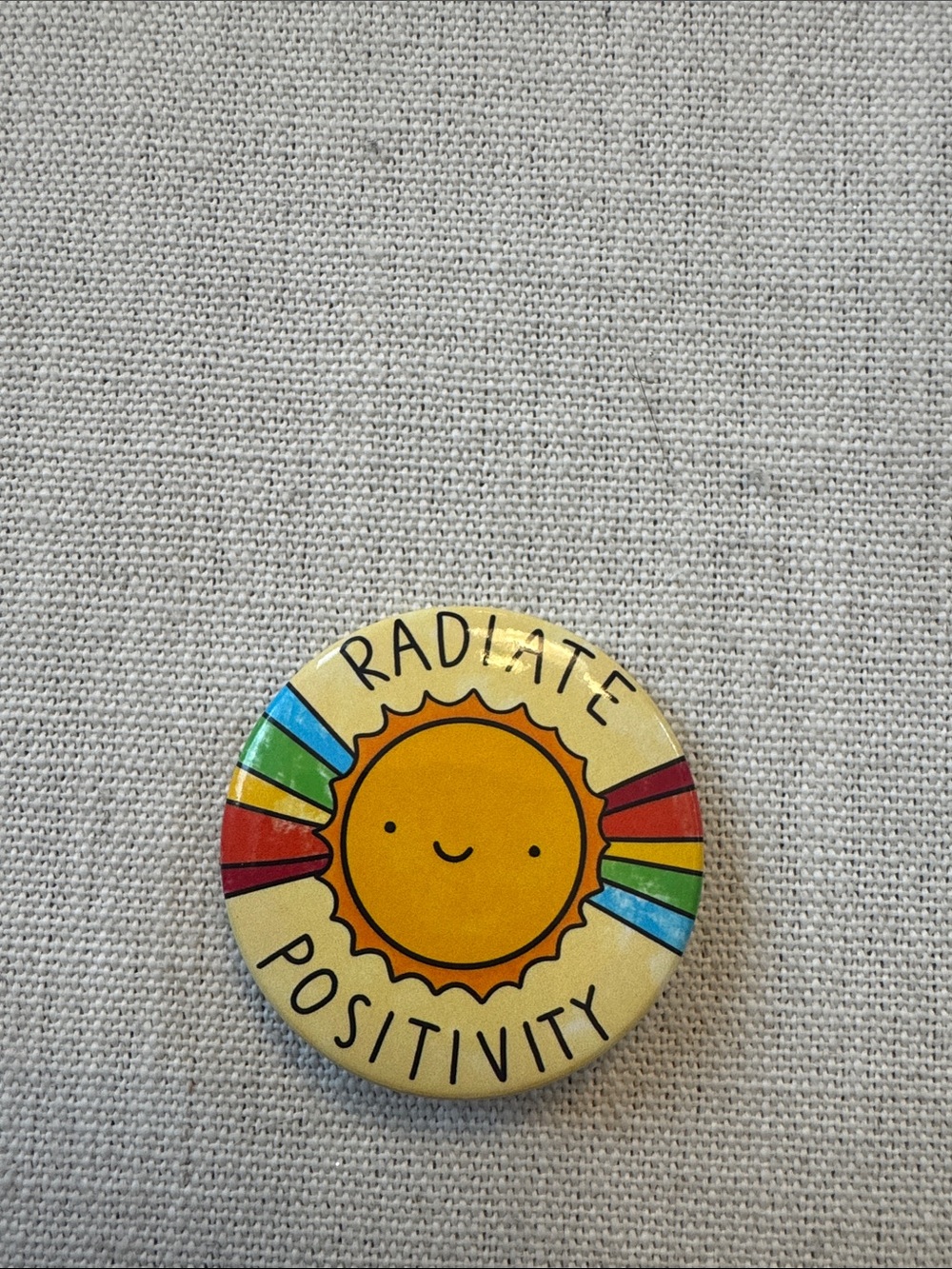 Radiate Positivity Sun Button Pin - Yellow with Rainbow Accents